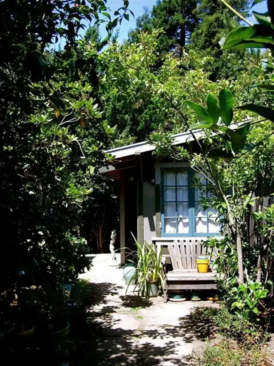 Garden cottage at the end of a leafy path