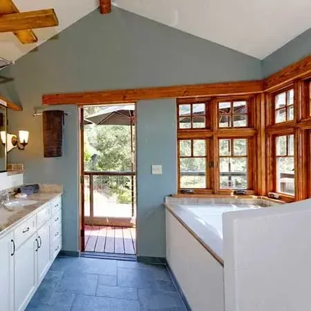 Robinson Drive bathroom with wood-framed bay window and slate floor